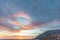 Dramatic colored sky at sunset. Moon and star in the clouds.