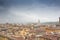 Dramatic colorful aerial view of the beautiful city of Florence. Colorful rainy cityscape with dark blue clouds. Florence, Italy