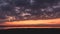 Dramatic colorful orange sunset with clouds overlooking the salt marshes of Jekyll Island, Georgia