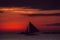 Dramatic colorful sea sunset with sailboat. Summer time. Travel to Philippines. Luxury tropical vacation. Boracay paradise island