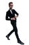 Dramatic cool businessman adjusting suit and confidently walking