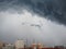 Dramatic cumulonimbus stormy clouds over city