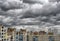 Dramatic cumulonimbus stormy clouds over cityscape