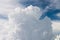 Dramatic cumulus cloud in a blue sky high in the atmosphere