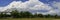 Dramatic cumulus cloudscape over the Sagamore Bridge and public baseball field on Cape Cod