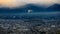 Dramatic and dark process cityscape in strom and smog layer mountain background in japan