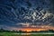 Dramatic dense cloudy sky near lake