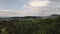 Dramatic drone shot revealing the village MÃ¶ssingen through apple trees in Germany.