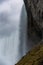 Dramatic epic view behind a roaring waterfall