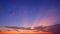 Dramatic Evening Sky Background with Majestic orange sunlight and clouds on dark blue Twilight sky