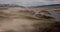 Dramatic fall dark desert steppe on a highland mountain plateau with ranges of hills on a horizon storm skyline. Aerial