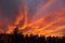 Dramatic fiery sky sunset cloudscape at dusk