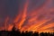 Dramatic fiery sky sunset cloudscape at dusk