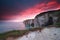 Dramatic fire sunrise over cliffs in ocean