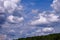 Dramatic fluffy cloudscape and deep blue sky