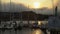 Dramatic fog rolls over mountains beyond sailboats docked in Horseshoe Bay