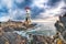 Dramatic gloomy view of Capo Ferro Lighthouse