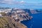 Dramatic Greek landscape showing the cliffs of Santorini and the Aegean Sea.