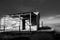 Dramatic high contrast image image of old weathered wooden storage barns on a salt mine on caribbean coast.