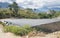 Dramatic image of greenhouse shade farm on the mountain countryside of fields and farms in the caribbean, dominican republic.