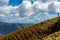 Dramatic image of a Haitian farm workers cultivating side of a mountain high in the caribbean island of the dominican republic.