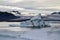 Dramatic image of icebergs in Jokulsarlon lagoon at the evening. South Iceland