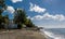 Dramatic  image of an ocean eroded home on caribbean coast