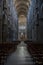 Dramatic interior of cathedral with rows of chairs