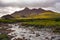 Dramatic landscape of Cuillin hills and river, Scottish highland