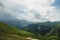 Dramatic landscape of a green valley at the foot of the Inal Plateau in the North Caucasus