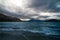 Dramatic landscape of tumultuous lake Wakatipu with hills of Central Otago, New Zealand