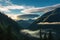 dramatic lenticular cloudscape above a forested mountain valley