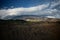 Dramatic lights on Etna Mount blanketed in clouds