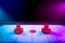 Dramatic lit air hockey table with puck and paddles