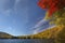 Dramatic, low perspective of fall foliage, Russell Pond, New Ham