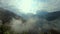 Dramatic moody sky covered with heavy low clouds and mountain background at morning