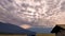 Dramatic moody sky covered with heavy low clouds and mountain background at morning