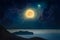 Dramatic mystical background - rising full moon in dark night sky above mountains with reflection in water. Full moon occurs