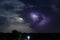 Dramatic night cloudscape with thunderbolt lightning and moon light