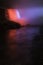A dramatic nighttime closeup of a section of Niagara Falls and t
