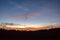 Dramatic orange and blue cloud and sky after storm and raining over agricultural field