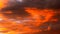 Dramatic orange clouds at sunset. Cloudscape abstract background photo.