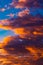 Dramatic orange clouds at sunset. Cloudscape abstract background photo.