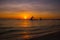Dramatic orange sea sunset with sailboats in tropical country, clouds. Philippines, Boracay