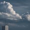 Dramatic overcast dark clouds and lightning rod architecture