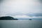 A dramatic, overcast scenery on the coeast of fjord during a ferry ride in Norway near Bergen.