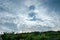 Dramatic overcast sky with sunlight over a tropical land