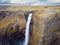 Dramatic overview of Haifoss waterfall, the fourth highest waterfall(122m) of the island, and colorful canyon situated near the