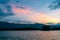Dramatic panorama evening sky and clouds over mountain and lake at sunset