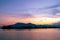 Dramatic panorama evening sky and clouds over mountain and lake at sunset